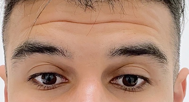 Close-up of a person's eyes and eyebrows.