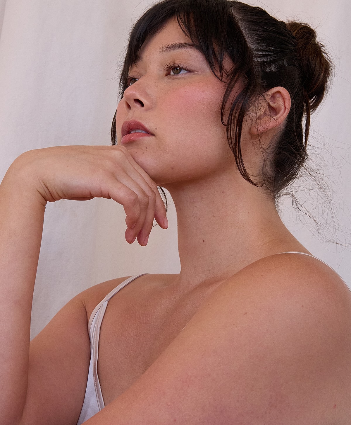 Profile of a woman deep in thought.