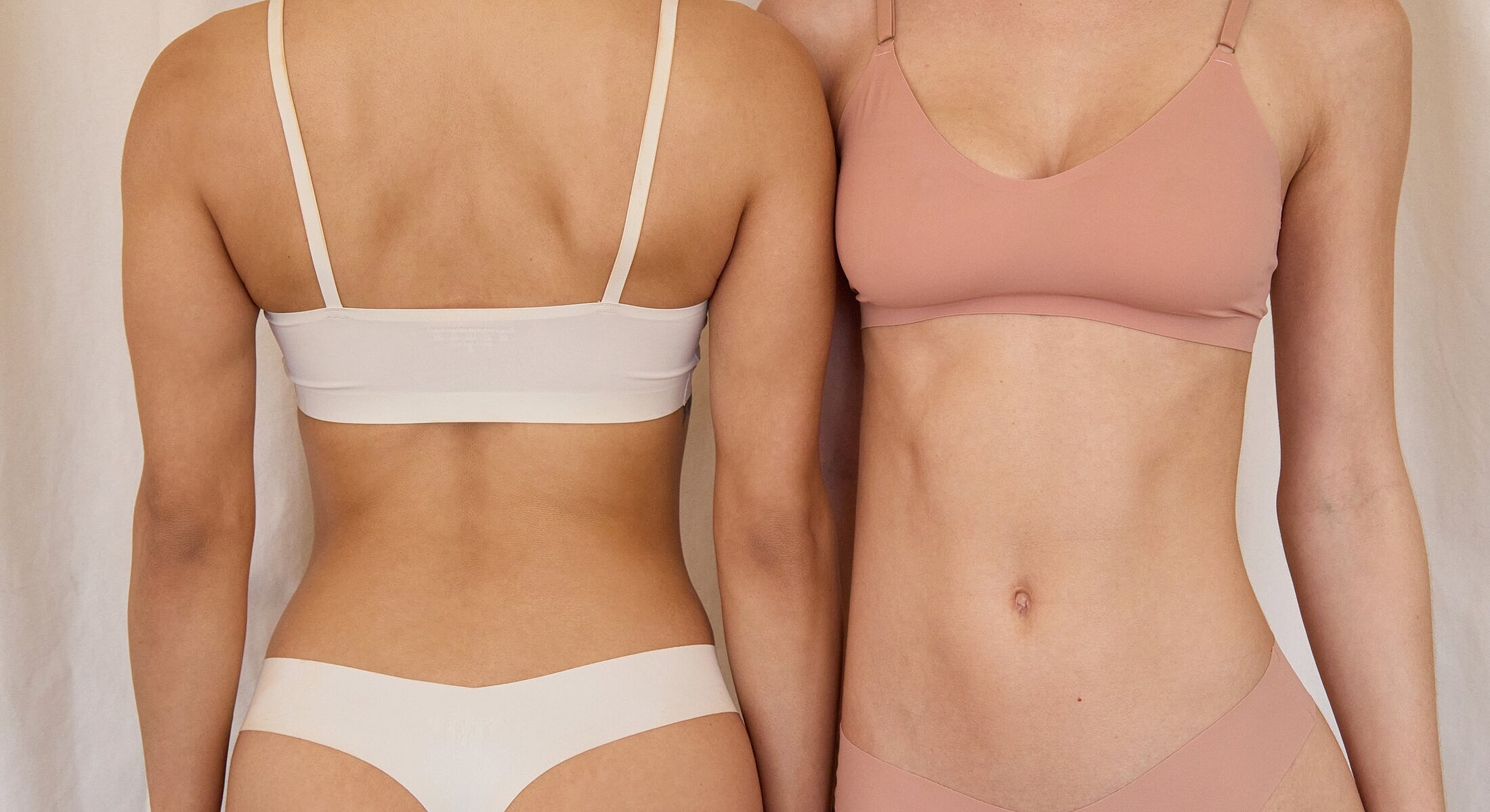 Models wearing minimalist lingerie against a neutral background.