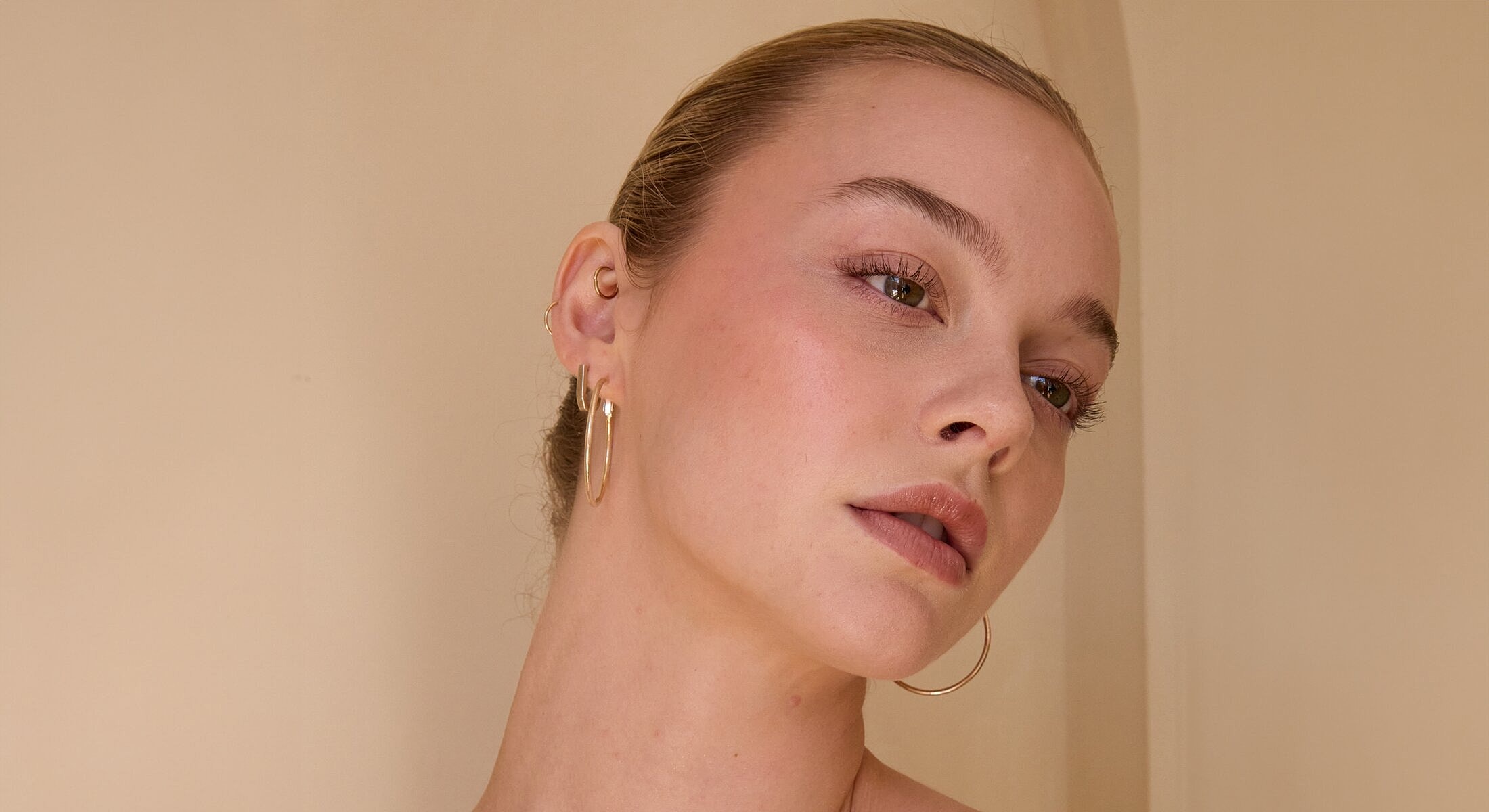 Portrait of a woman with hoop earrings.